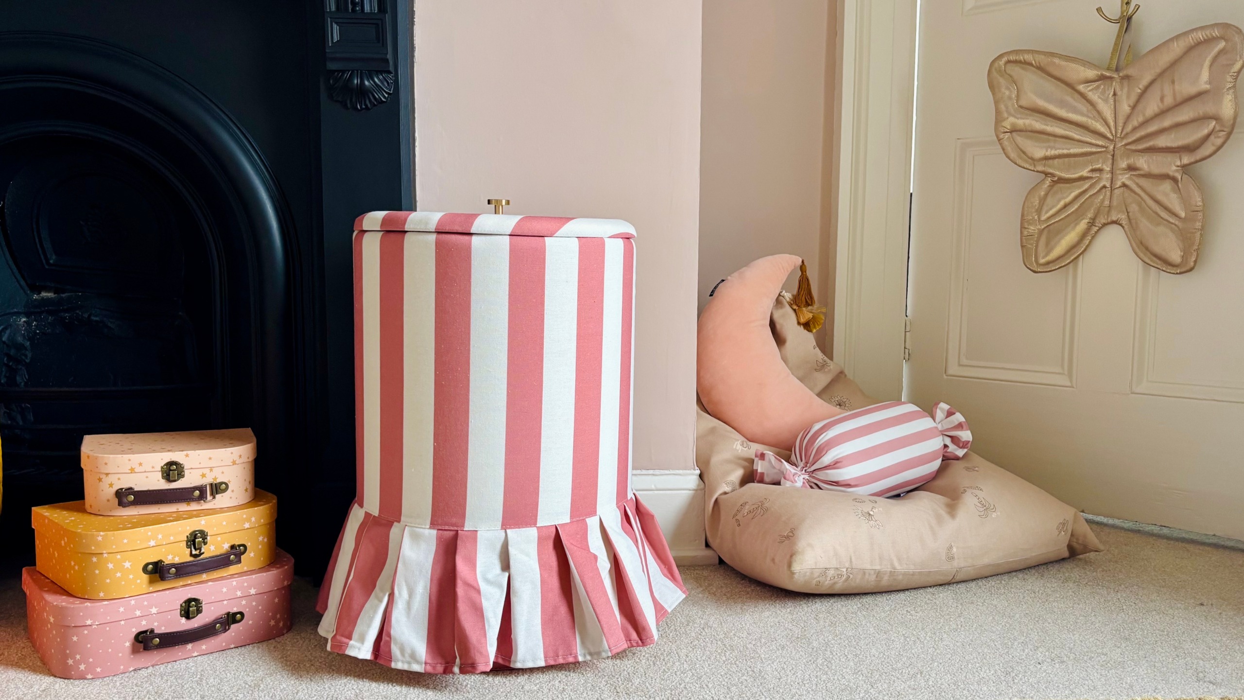 next striped frill laundry hamper in a pink bedroom
