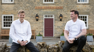 Head chef Charlie Smith and chef director Tommy Banks sit outside the Abbey Inn