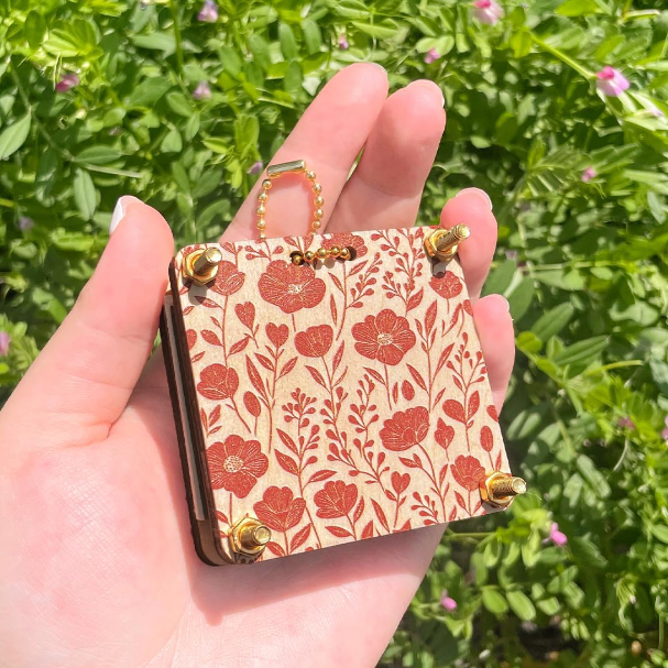 a small hand sized press for pressing flowers