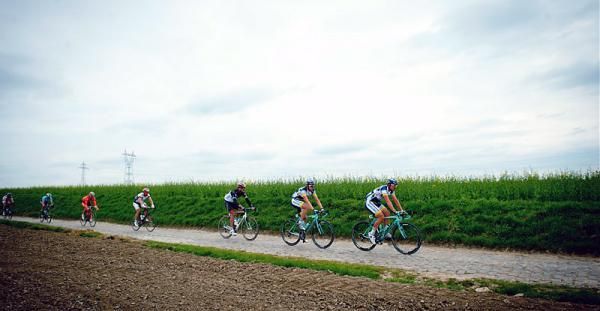 Riders roll along through the countryside of northern France during the 2012 edition of Paris-Roubaix.