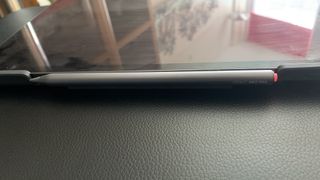 Adonit Neo Pro stylus clipped magnetically to the side of a tablet