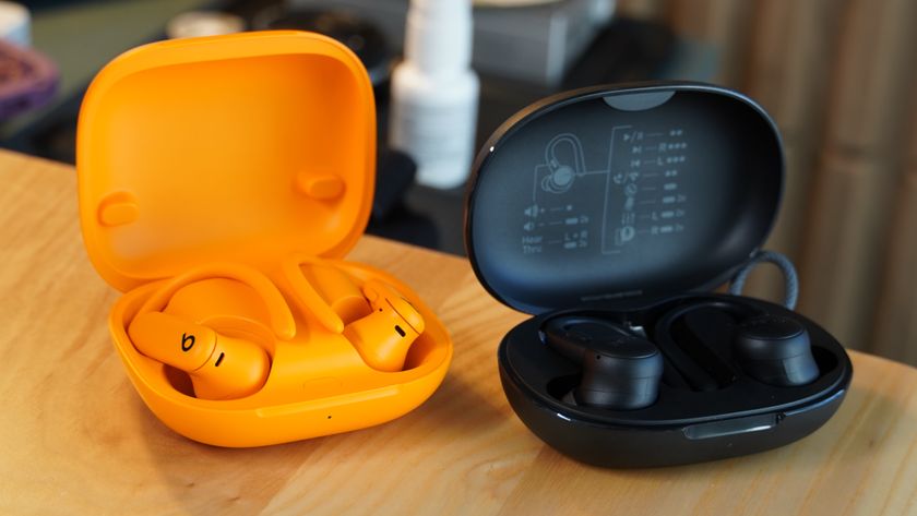 The orange Powerbeats Pro 2 compared with the black Belkin SoundForm ActiveFit.