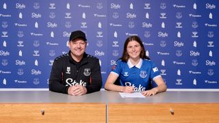 Emma Bissell poses for a photo with manager Brian Sorensen after signing for Everton Women on August 1st, 2023 in Halewood, England
