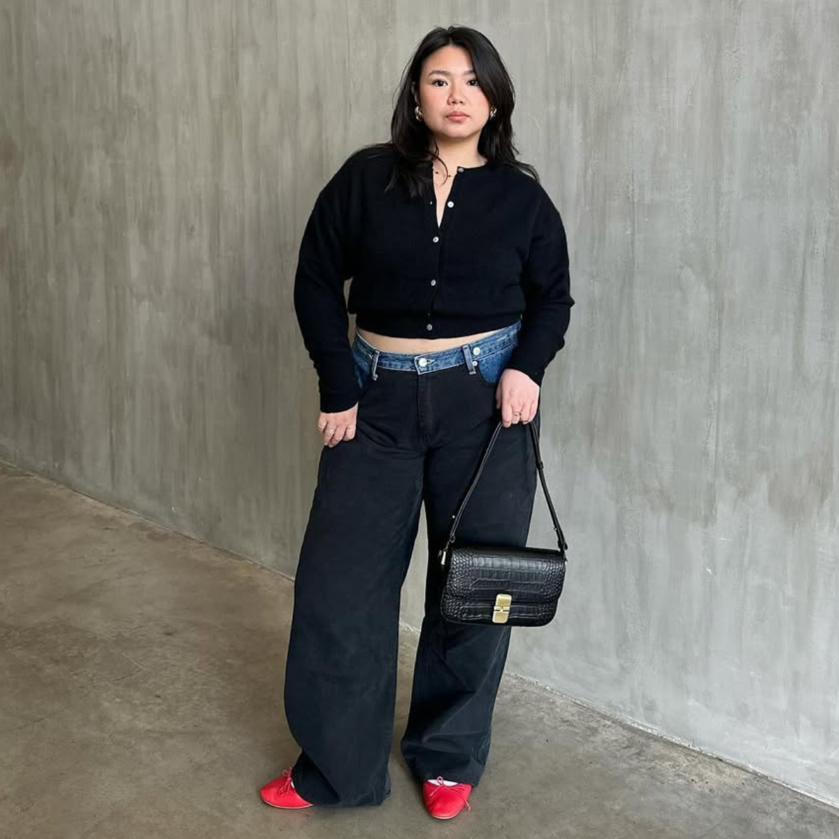 Marina in cropped cardigan, black jeans and red ballet flats