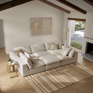 a beige pit sofa in a modern home