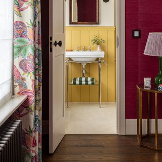 yellow ensuite bathroom with door open