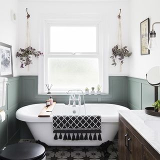 Bathroom with green half wood paneling