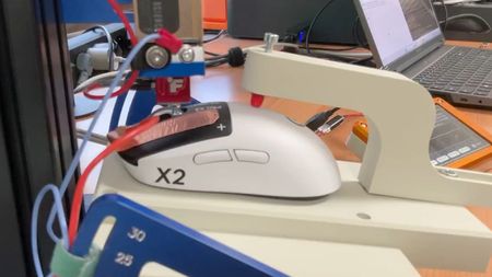 A Logitech G Pro X2 Superstrike's mouse click speed being tested on a machine by Finalmouse.