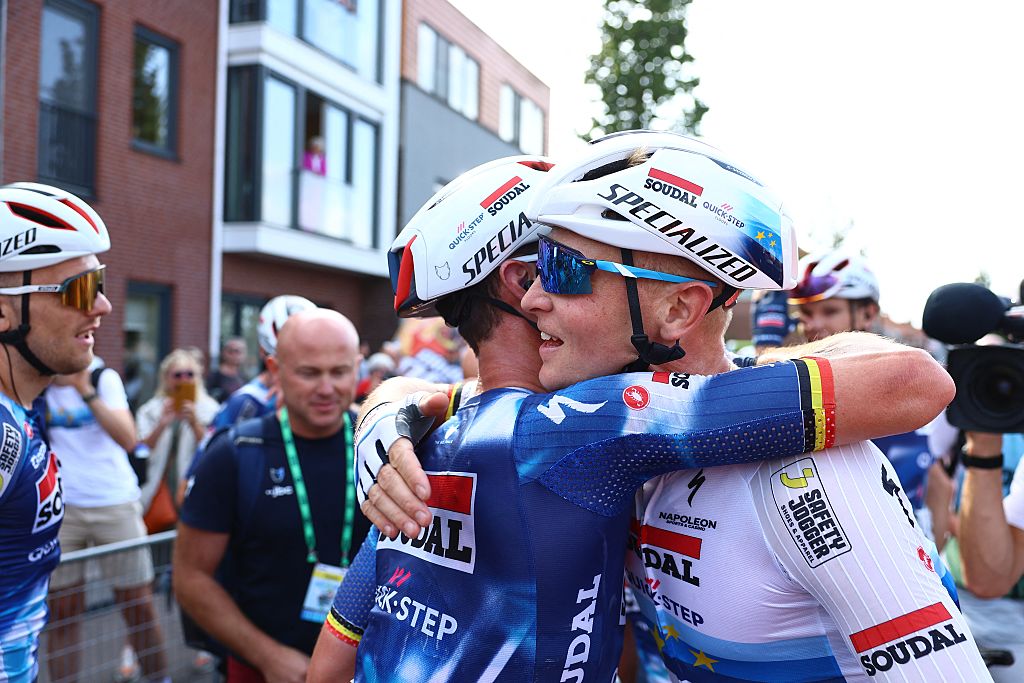 Tim Merlier celebrates winning stage 1