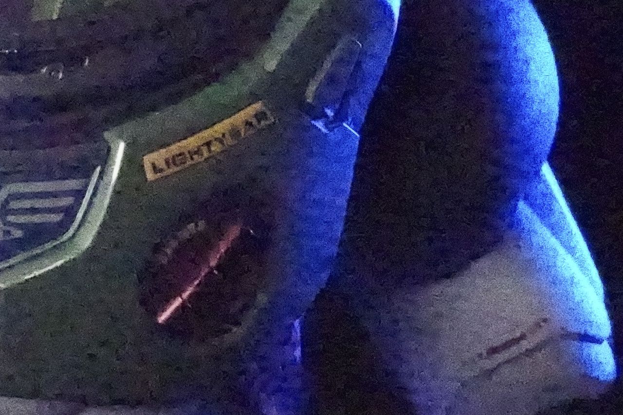 Sony ZV-E10 II sample images of buzz lightyear toy in dark studio taken at different ISO settings