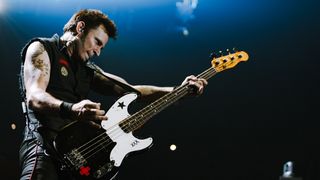 Mike Dirnt playing bass on stage