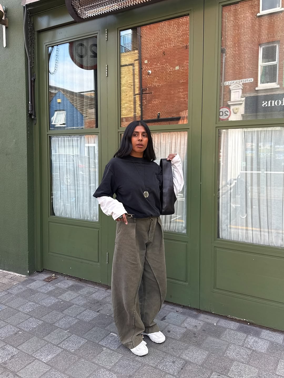 woman wearing winter sneaker outfit 2025