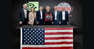 Nvidia CEO Jensen Huang holding the first Blackwell Wafer to come out of TSMC Arizona, next to the TSMC Arizona CEO and other execs.
