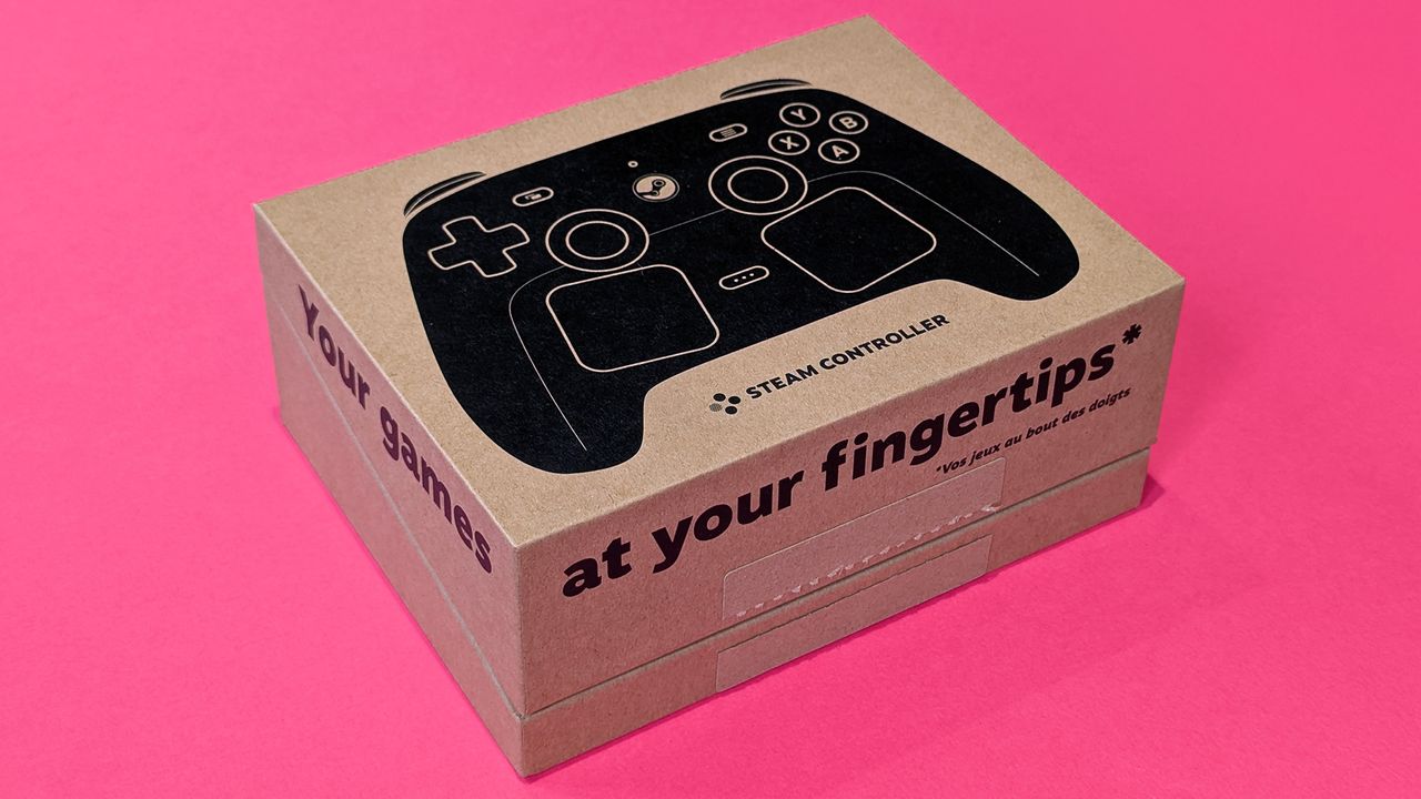 Valve Steam Controller (2026) in its retail box, displayed on a magenta card background