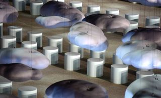 individual 'marshmallow' cylindar stools, the soft clouds of the set above them