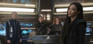 From left to right, Stamets, Georgiou, Tilly, and Michael Burnham stand on the bridge of the Discovery.