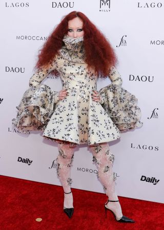 Chappell Roan Just Wore A Mini Dress With A Ruffle Hiding Her Face, And It’s Giving Me Serious 1500s Vibes