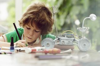 child building a robot