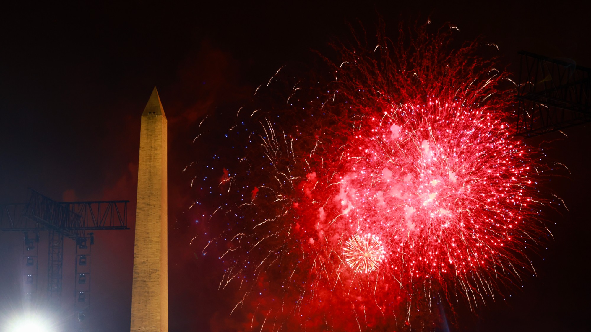 Fireworks explode behind the Washington Monument in Washington, D.C. 