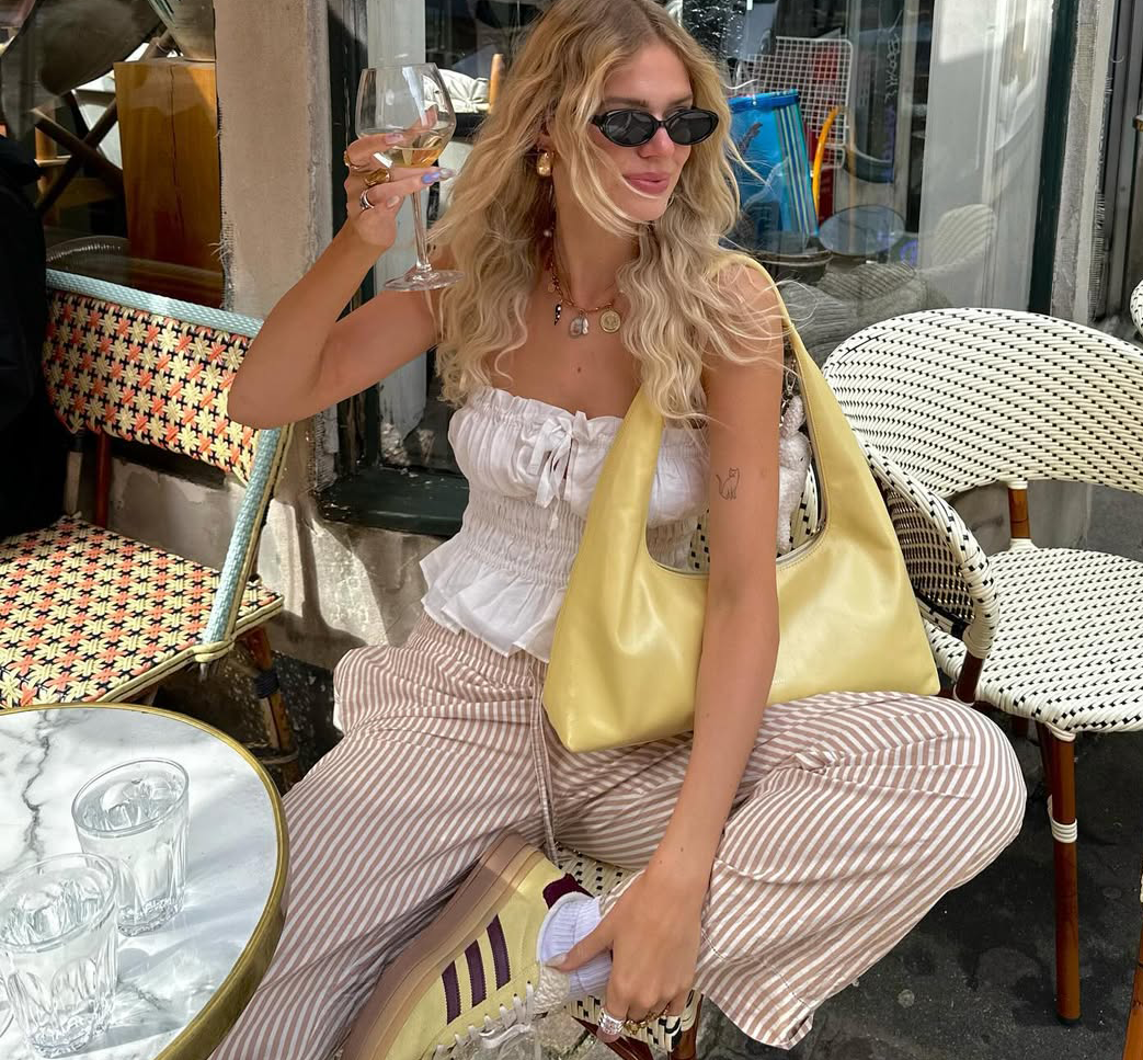 An influencer wearing adidas sneakers.