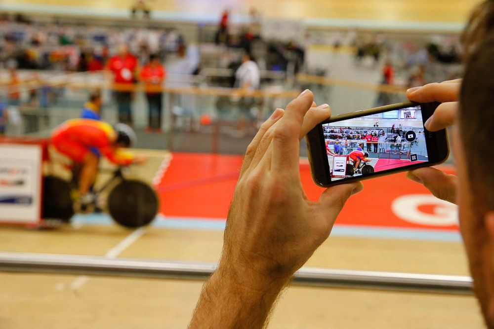 Catching the action with a smart phone.