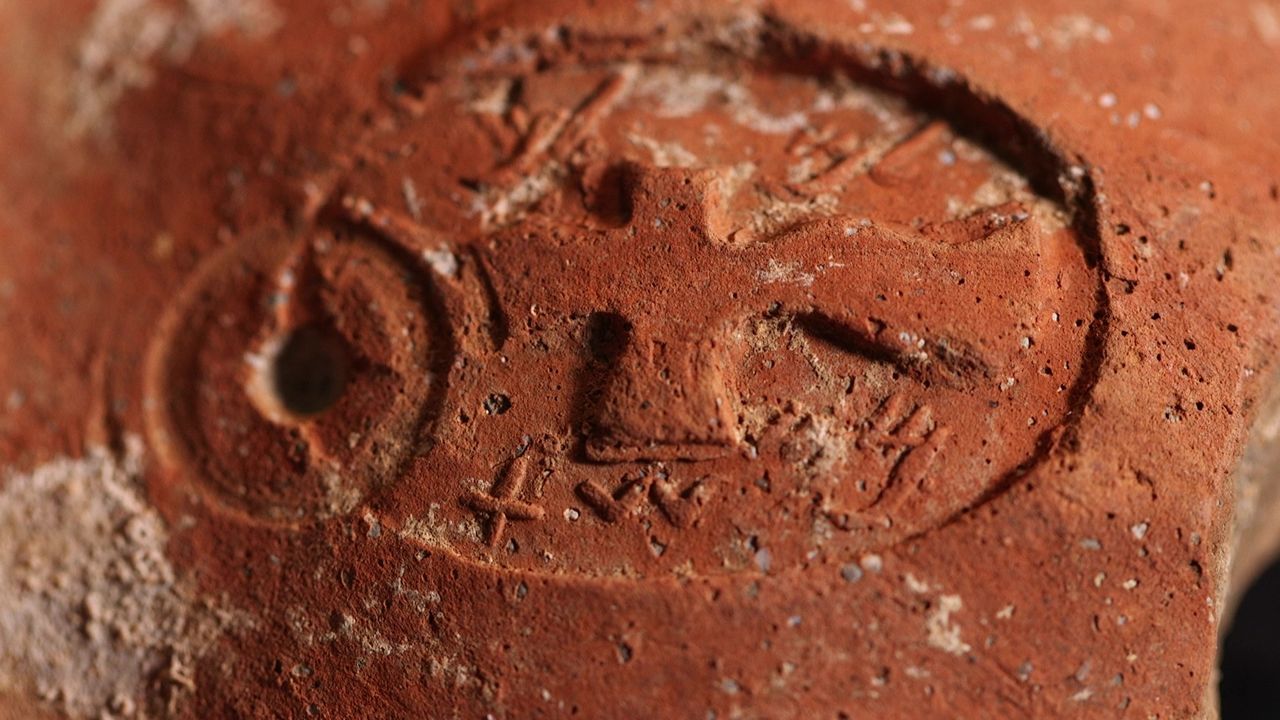 A ceramic fragment with a stamp impression