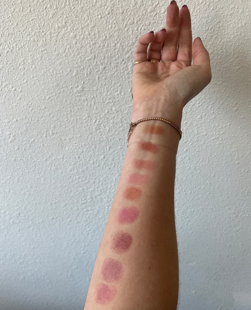 Who What Wear editor Caitie Schlisserman testing the Merit Flush Balm.