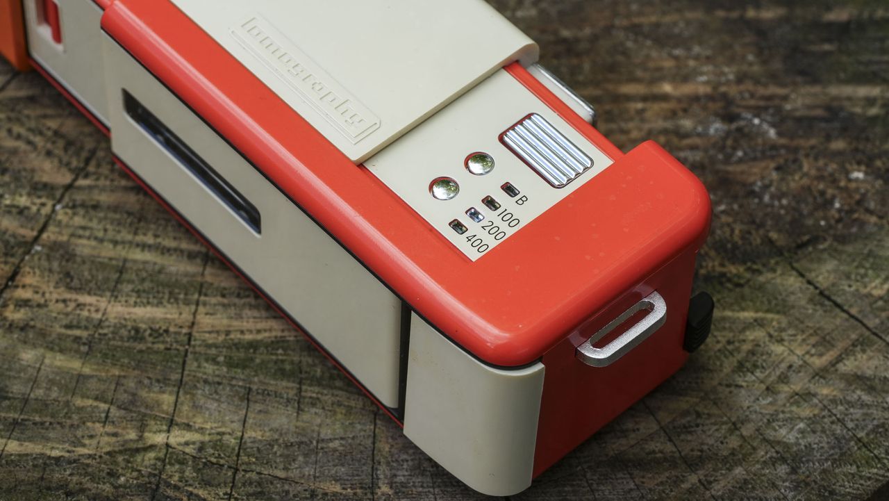A close up image showing the controls of the Lomography Lomomatic 110 film camera