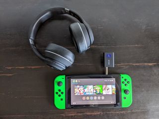 How to use Bluetooth headphones with a Nintendo Switch via the headphone jack: place your headphones and the adapter near each other and allow them to pair, it's successful when the transmitter's blue
