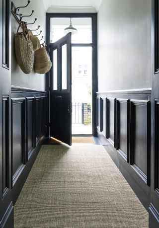 Hallway with natural flooring