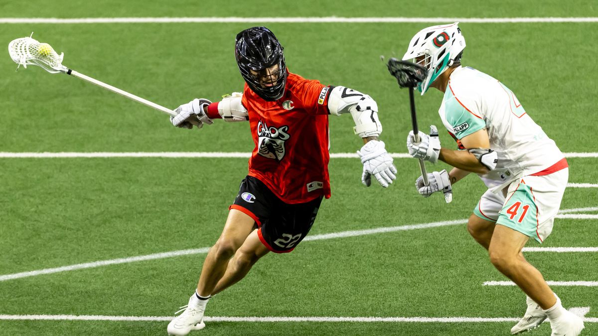 Chaos attackman Josh Byrne (22) battles with Whipsnakes defenseman Byce Young (41) ahead of the World Lacrosse Box Championships 2024