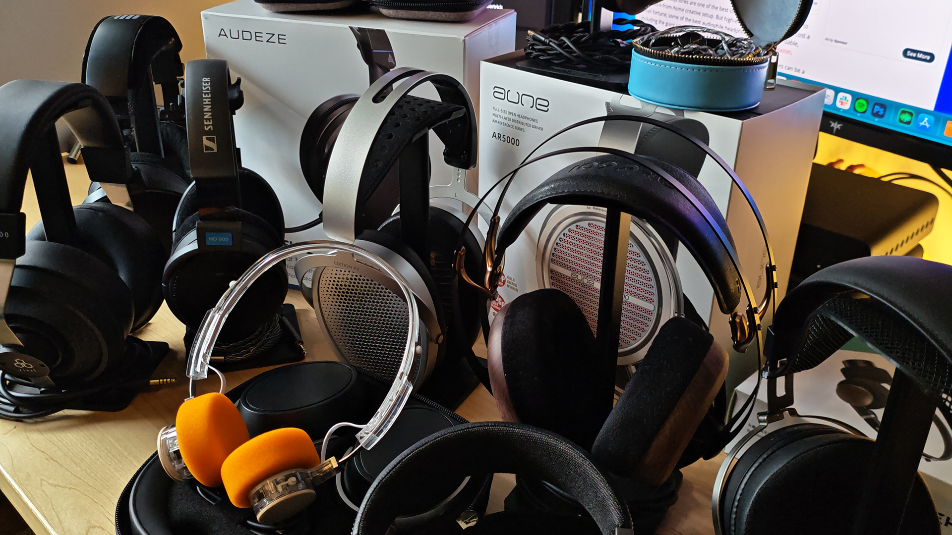 A selection of headphones on a desktop.