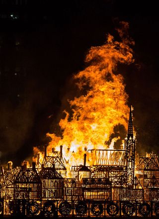A wooden replica of 1666 London is set on fire on the River Thames to mark 350 years since the event, in September