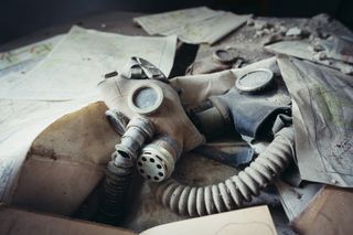 A gas mask among papers in Chernobyl.