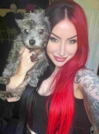 Ash Costello with her pet dog Barnabus
