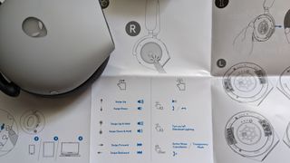 Alienware 920H instructions booklet next to earcup