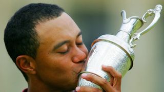 Tiger Woods kisses the Claret Jug after winning the 134th Open Championship on the Old Course in St. Andrews, Scotland, 17 July, 2005.