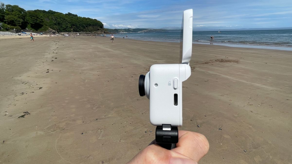 Insta360 GO 3 action camera on a beach