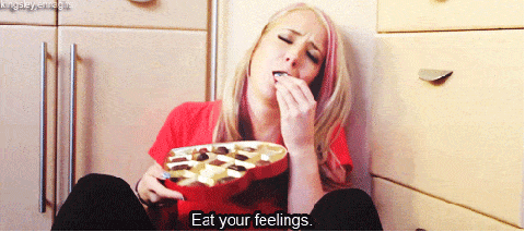 Woman eating chocolates gif