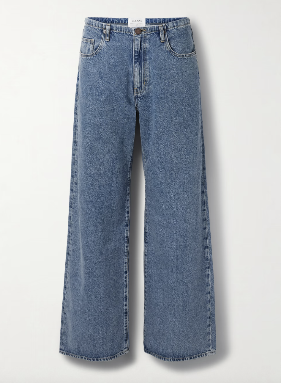 a pair of drawstring jeans by la ligne in front of a plain backdrop