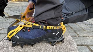 Snipping a crampon strap down to size