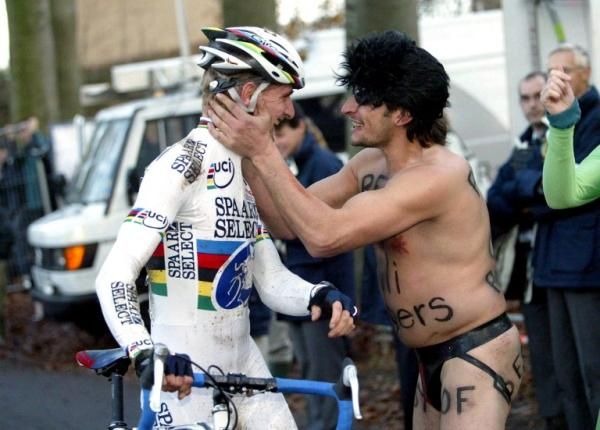Even fans in Belgium dress crazy. Bart Wellens is accosted by a man in a string bikini in 2003