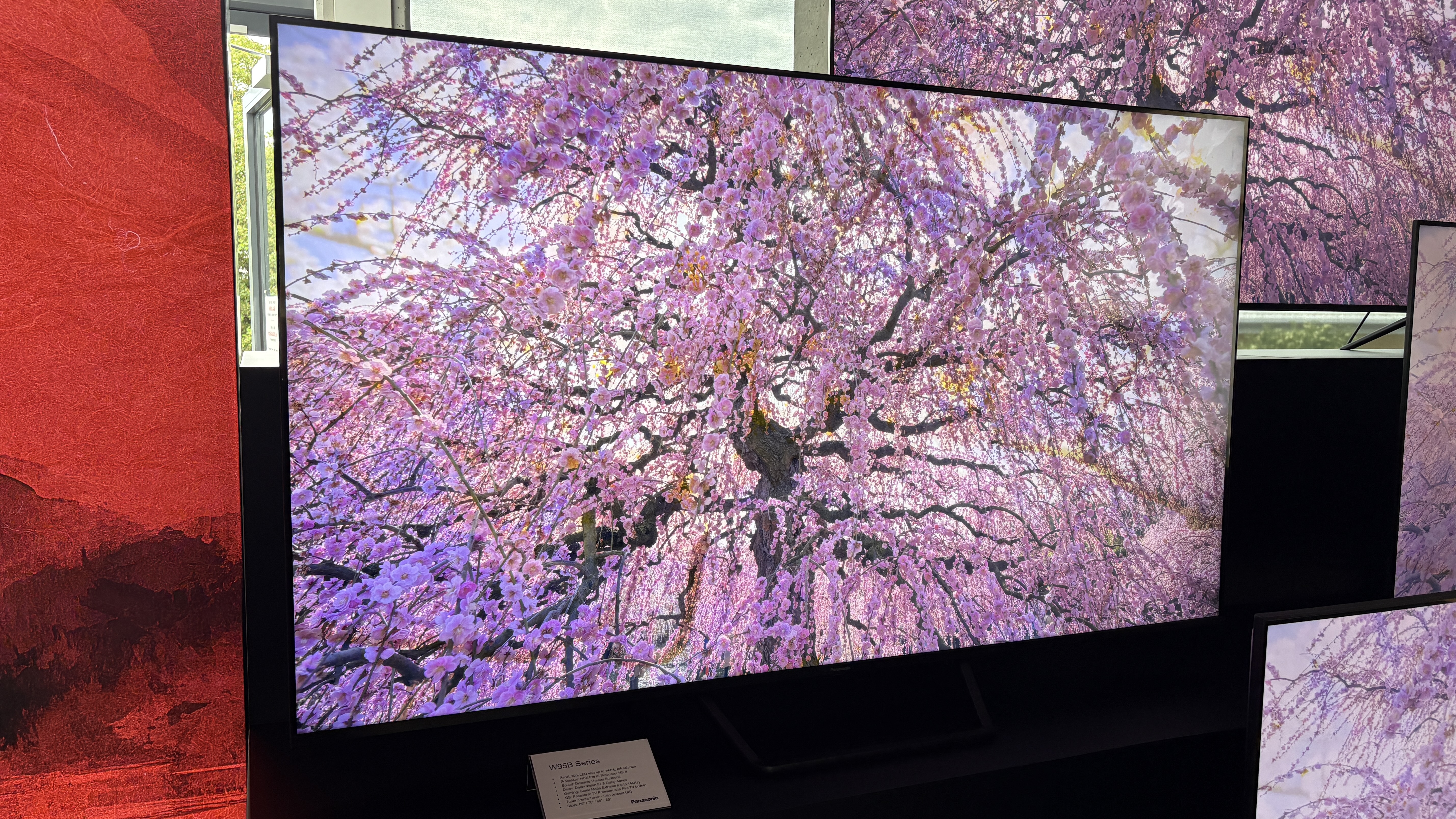 Panasonic TVs on a black show stand