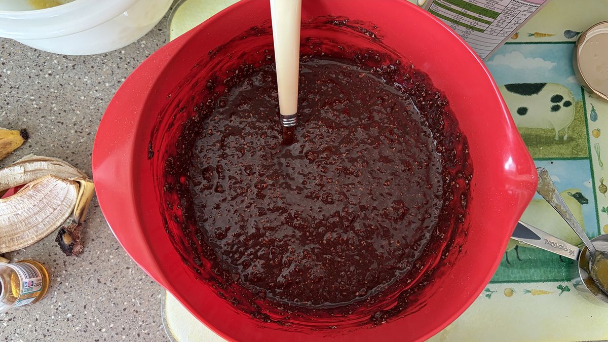 A close up of a bowl with brownie mixture in it
