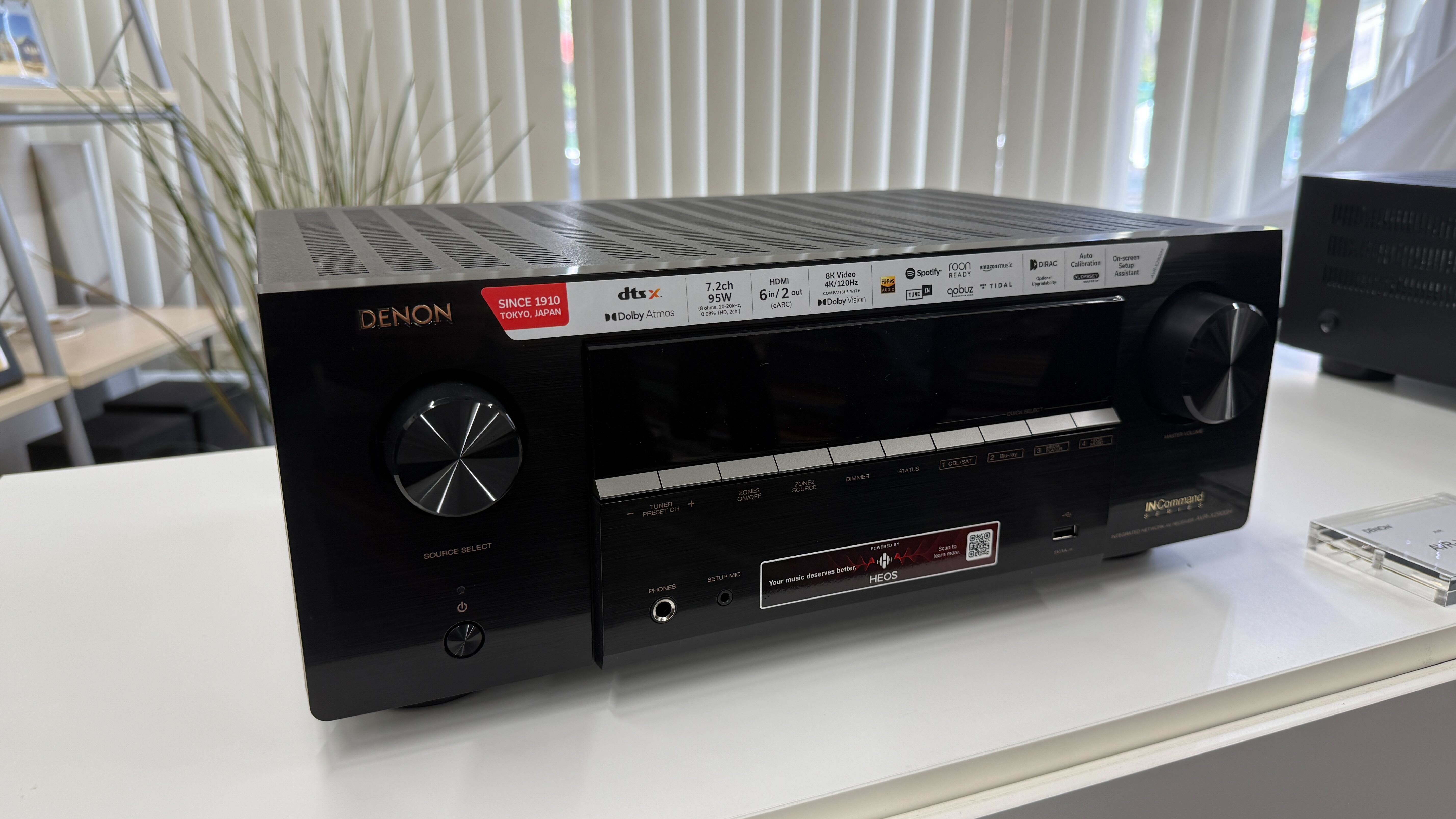 A Denon AVR-X2900H home cinema amplifier on a white table