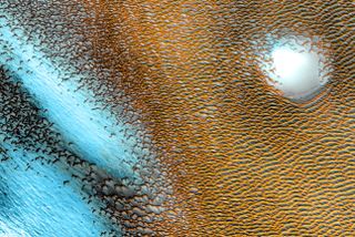 The north pole of Mars glows blue and gold in this false-color heat map.