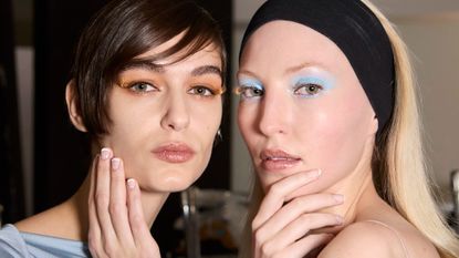two models with green eyes wearing eyeshadow