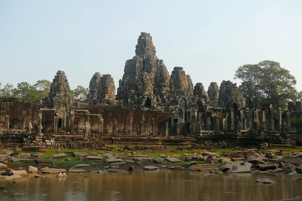 Bayon temple, constructed by Angkorian King Jayavarman VII in the late 12th century. The faces may be representations of Buddha, the bodhisattva Lokesvara, Jayavarman VII, or a combination.