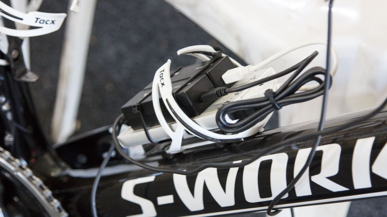 The mechanic at Ettix-Quick Step had this clever approach to Shimano Di2 battery charging. It's a USB laptop/mobile charging battery with Di2 chargers zip tied in place