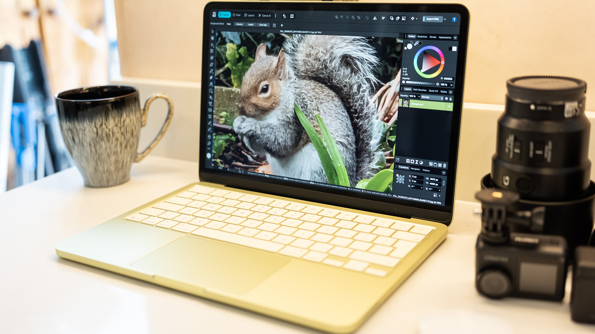 Apple MacBook Neo laptop in yellow on a desk